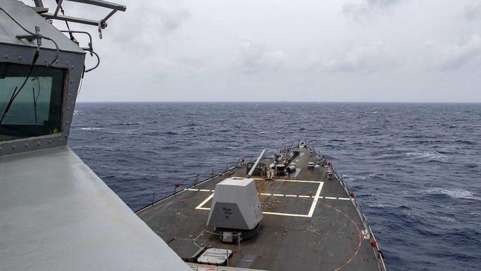 The Arleigh Burke-class guided-missile destroyer USS Mustin (DDG 89) conducts routine operations in the South China Sea. Mustin is forward-deployed to the U.S. 7th Fleet area of operations in support of security and stability in the Indo-Pacific region. (U.S. Navy photo by Mass Communication Specialist 3rd Class Cody Beam)