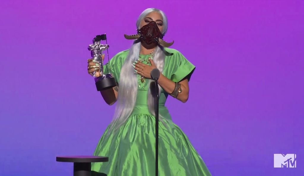 This combination photo of video grabs by MTV, issued Sunday, Aug. 30, 2020, shows Lady Gaga wearing masks during the MTV Video Music Awards. (MTV via AP)