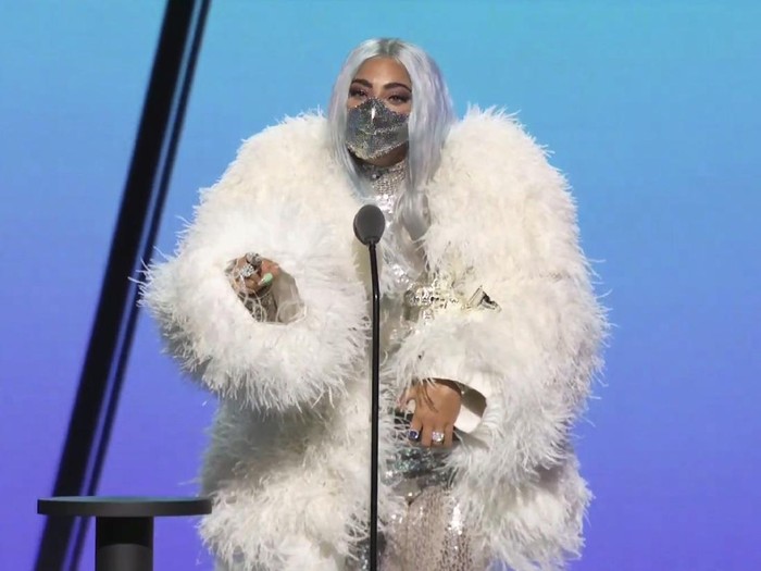 This combination photo of video grabs by MTV, issued Sunday, Aug. 30, 2020, shows Lady Gaga wearing masks during the MTV Video Music Awards. (MTV via AP)