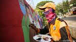 Mural di Bukit Duri Ini Minta Warga Waspada COVID-19