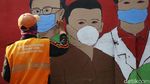 Mural di Bukit Duri Ini Minta Warga Waspada COVID-19