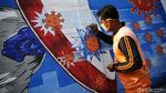 Mural di Bukit Duri Ini Minta Warga Waspada COVID-19