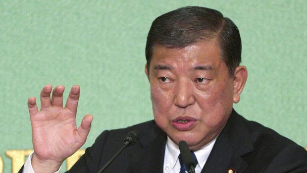 One of candidates for president of ruling party Shigeru Ishiba speaks during a debate with Japanese Prime Minister and head of current party president Shinzo Abe ahead of Liberal Democratic Party president election in Tokyo Friday, Sept. 14, 2018. Abe is vying for his third re-election as the ruling party leader next week, extending his stay in power to work on his long-cherished ambition, to revise his country's war-renouncing constitution. (AP Photo/Eugene Hoshiko)