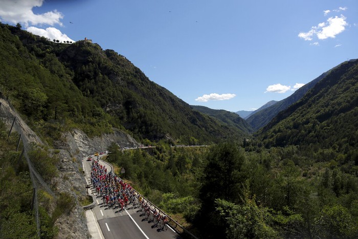 Spectators watch the riders in the Eze pass during the second stage of the Tour de France cycling race over 186 kilometers (115,6 miles) with start and finish in Nice, southern France, Sunday, Aug. 30, 2020. (AP Photo/Thibault Camus)