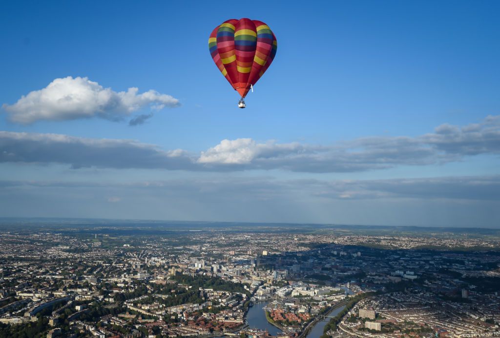 BRISTOL, ENGLAND - SEPTEMBER 01: A shadow of a balloon is seen as musician Jerome Gamble plays guitar to accompany the recorded music as it is played to the city below on September 01, 2020 in Bristol, England. Created by Bristol-based artist Luke Jerram and composer Dan Jones, 