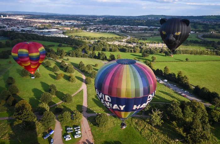 BRISTOL, ENGLAND - SEPTEMBER 01: A shadow of a balloon is seen as musician Jerome Gamble plays guitar to accompany the recorded music as it is played to the city below on September 01, 2020 in Bristol, England. Created by Bristol-based artist Luke Jerram and composer Dan Jones, 