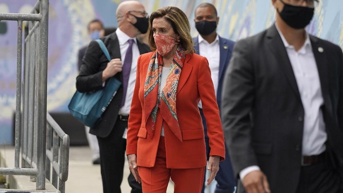 House Speaker Nancy Pelosi walks with her staff to a news conference at the Mission Education Center Elementary School, Wednesday, Sept. 2, 2020, in San Francisco. Pelosi said she takes responsibility for trusting the word of a San Francisco hair salon shes visited over the years when it told her it was OK to come in for a solo visit this week, even though the city still does not allow indoor beauty services. (AP Photo/Eric Risberg)