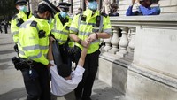 Kepolisian London mengancam jika unjuk rasa berujung ricuh maka mereka tidak segan menangkap pihak yang terlibat. AP Photo/Kirsty Wigglesworth  