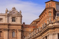 Vatican City, Vatican City State - October 11, 2007: External view of the Sistine Chapel at the Vatican City, seen at the centre of the photo. It is towards this roof that the faithful gathered in Saint Peters Square look to, for the first signs of a newly elected pope by the Conclave of the College of Cardinals: black smoke denotes that the ballot was inconclusive, white smoke indicates they have a new Pope. The Sistine Chapel is the Popes private chapel. To the left is a section of St. Peters Basilica. To the right is a section of the Vatican Museum and Palace. Photo shot in the afternoon sunlight from St. Peters Square; horizontal format.