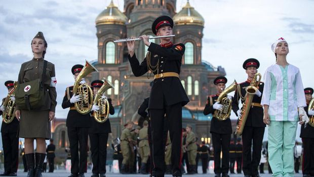 Russian Navy band performs during the Spasskaya Tower military music festival in front of the Cathedral of Russian Armed Forces in Kubinka, outside Moscow, Russia, Sunday, Sept. 6, 2020. Due to coronavirus, the annual international music festival in Red Square was canceled, an online festival without spectators took place Sunday on the Cathedral Square in Patriot Park, outside Moscow. (AP Photo/Pavel Golovkin)