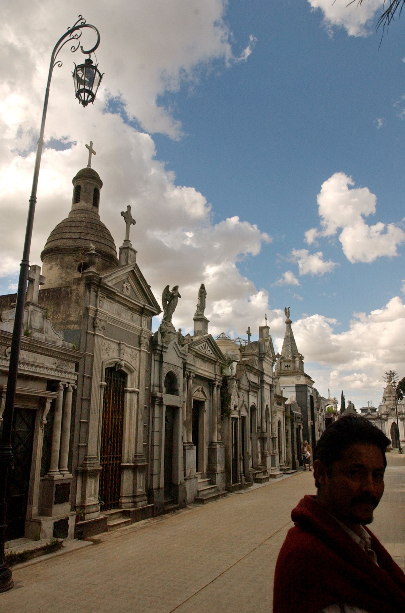 Tourists arrive to Recoleta cemetery,  the posh resting place for Buenos Aires' rich and powerful, to visit the tomb of Evita Peron, the wife of former Argentina's strongman Juan Peron, Nov. 19, 2003.  Evita's tomb, like Gardel's, has become something of a shrine. (AP Photo/Natacha Pisarenko)