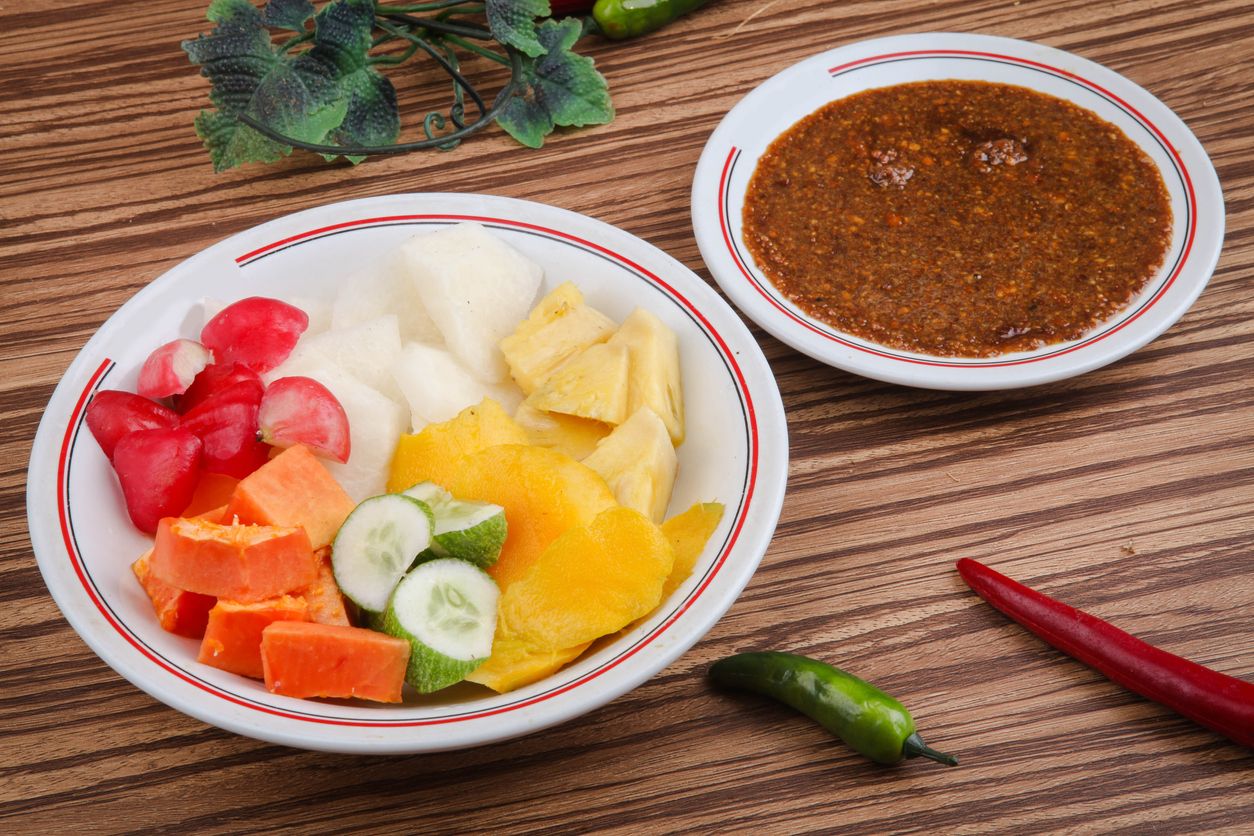Rujak Buah or Rujak is a traditional Indonesian food, from fruit that is cut into pieces with brown sugar sauce and peanuts as a companion