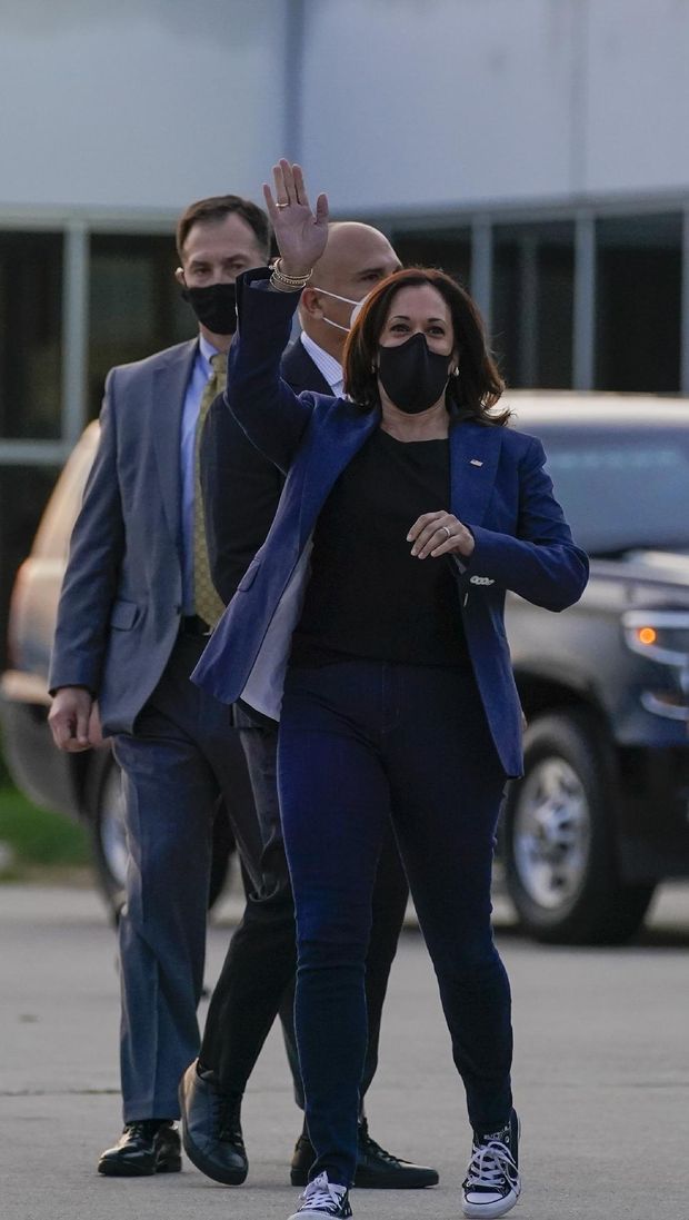 Democratic vice presidential candidate Sen. Kamala Harris, D-Calif., waves before boarding her plane after a campaign stop Monday, Sept. 7, 2020, in Milwaukee. (AP Photo/Morry Gash)