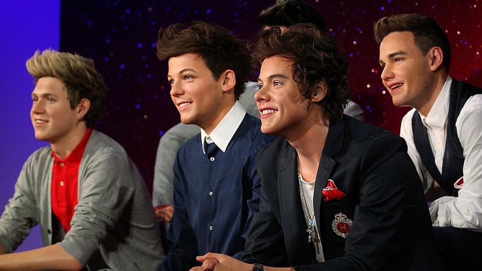 Patung One Direction diperkenalkan di museum Madame Tussauds, London, Inggris, pada 2013. Peresmian patung dihadiri para personel aslinya.