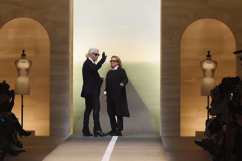 MILAN, ITALY - SEPTEMBER 18: Karl Lagerfeld and Silvia Venturini Fendi  acknowledge the applause of the audience after the Fend show as a part of Milan Fashion Week Womenswear Spring/Summer 2015 on September 18, 2014 in Milan, Italy.  (Photo by Tullio M. Puglia/Getty Images)