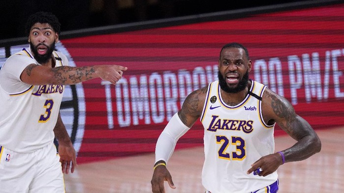 Los Angeles Lakers LeBron James, right, and Anthony Davis argue a call during the first half of an NBA conference semifinal playoff basketball gameagainst the Houston Rockets Saturday, Sept. 12, 2020, in Lake Buena Vista, Fla. (AP Photo/Mark J. Terrill)