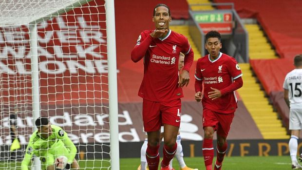 Liverpool vs Leeds United Liverpool's Virgil van Dijk, center, celebrates after he scored his side's second goal during the English Premier League soccer match between Liverpool and Leeds United, at the Anfield stadium, in Liverpool, Saturday, Sept. 12, 2020. (Paul Ellis, Pool via AP)