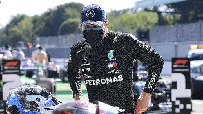 Mercedes driver Valtteri Bottas of Finland stands after clocking the second fastest time during the qualifying session for Sundays Italian Formula One Grand Prix, at the Monza racetrack in Monza, Italy, Saturday, Sept. 5, 2020. (Jennifer Lorenzini/Pool via AP)