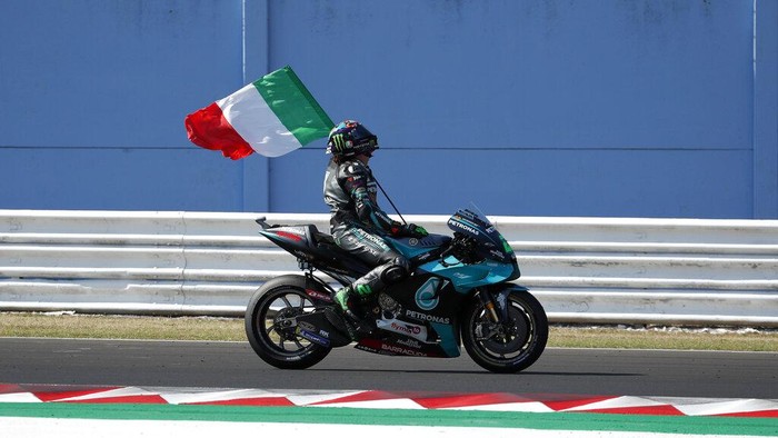 MotoGP rider Valentino Rossi of Italy takes a curve during the San Marino Motorcycle Grand Prix at the Misano circuit in Misano Adriatico, Italy, Sunday, Sept. 13, 2020. (AP Photo/Antonio Calanni)