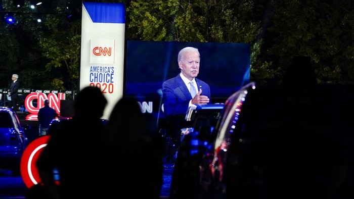 Democratic presidential candidate former Vice President Joe Biden ]is seen on a video screen as he participates in a CNN town hall moderated by Anderson Cooper in Moosic, Pa., Thursday, Sept. 17, 2020. (AP Photo/Carolyn Kaster)