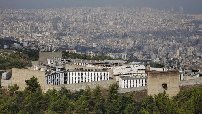 FILE - This Aug. 18, 2009 file photo, shows Roumieh Prison, in the Beirut suburb of Roumieh, Lebanon. The head of the countrys doctors union warned Thursday, Sept. 17, 2020 that Roumieh, Lebanons largest prison, is witnessing an alarming spread of coronavirus cases with more than 200 detainees testing positive recently and more could get the infection as many of them are not abiding by preventive measures. (AP Photo/Bilal Hussein, File)