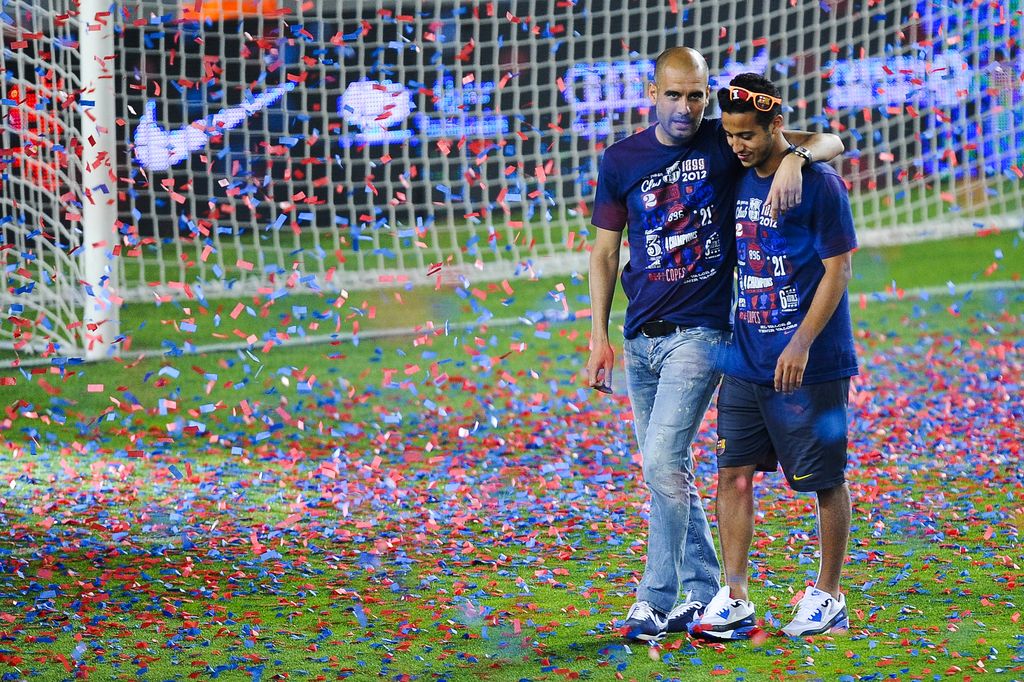 Pep Guardiola Thiago Alcantara BARCELONA, SPAIN - MAY 26: Head coach Josep Guardiola of FC Barcelona chats with Thiago Alcantara of FC Barcelona during the FC Barcelona celebrations following the club's victory of the Copa del Rey (King's Cup) at Camp Nou on May 26, 2012 in Barcelona, Spain. (Photo by David Ramos/Getty Images)