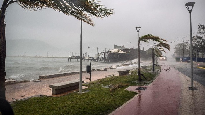 Damaged power and telecommunication lines are seen during a storm at the port of Argostoli, on the Ionian island of Kefalonia, western Greece, Friday, Sept. 18, 2020. A powerful tropical-like storm named Ianos battered the western islands of Zakynthos, Kefalonia, and Ithaki overnight, causing flash flooding, property damage, power outages, and road closures mostly from downed trees, police and local authorities said. (AP Photo/Nikiforos Stamenis)