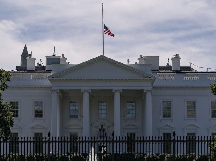 The US flag flies at half-mast above the White House in Washington, DC, on September 19, 2020 after the passing of US Supreme Court Justice Ruth Bader Ginsburg. - Ginsburg died September 18, opening a crucial vacancy on the high court expected to set off a pitched political battle at the peak of the presidential campaign. (Photo by Alex Edelman / AFP)