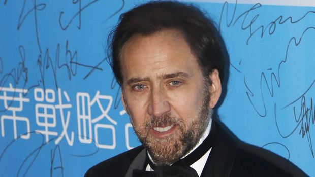 Actor Nicholas Cage arrives at the 10th Huading Awards ceremony in Macau Monday, Oct, 7, 2013. (AP Photo/Vincent Yu)