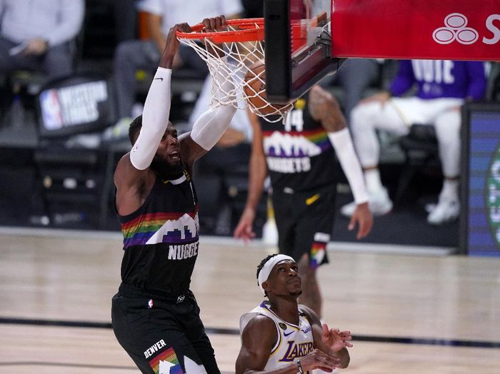 Lakers Nuggets Basketball Denver Nuggets forward Paul Millsap (4) dunks over Los Angeles Lakers Rajon Rondo (9) during the second half of Game 3 of the NBA basketball Western Conference final Tuesday, Sept. 22, 2020, in Lake Buena Vista, Fla. (AP Photo/Mark J. Terrill)