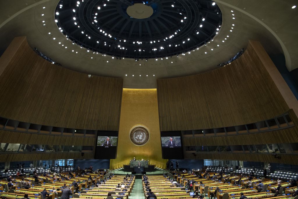 In this photo provided by the United Nations, Secretary-General António Guterres speaks from the podium, center, during the 75th session of the United Nations General Assembly, Tuesday, Sept. 22, 2020, at U.N. headquarters in New York. The U.N.'s first virtual meeting of world leaders started Tuesday with pre-recorded speeches from some of the planet's biggest powers, kept at home by the coronavirus pandemic that will likely be a dominant theme at their video gathering this year. (Eskinder Debebe/UN via AP)