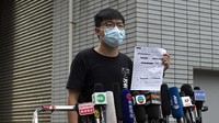 Tokoh pro-demokrasi berusia 23 tahun itu mengatakan di Twitter bahwa dia juga ditahan karena melanggar undang-undang anti-masker yang kejam, yang sejak itu dinyatakan tidak konstitusional.