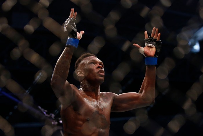 MELBOURNE, AUSTRALIA - OCTOBER 06: Israel Adesanya celebrates his victory over Robert Whittaker between in their Middleweight title bout  during UFC 243 at Marvel Stadium on October 06, 2019 in Melbourne, Australia. (Photo by Darrian Traynor/Getty Images)