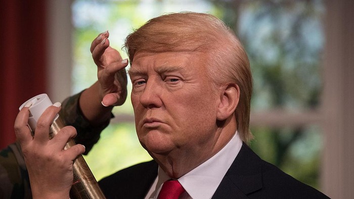 LONDON, ENGLAND - JANUARY 18:  Hair stylist Gemma Sim puts finishing touches in place as Madame Tussauds unveils a wax figure of President-Elect Donald J. Trump ahead of the inauguration on Friday at Madame Tussauds London on January 18, 2017 in London, England. The figure of Donald Trump is placed amongst the setting of the Oval Office.  (Photo by Chris J Ratcliffe/Getty Images)