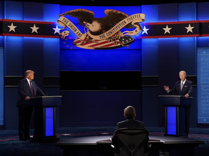 President Donald Trump, left, and Democratic presidential candidate former Vice President Joe Biden, right, with moderator Chris Wallace, center, of Fox News during the first presidential debate Tuesday, Sept. 29, 2020, at Case Western University and Cleveland Clinic, in Cleveland, Ohio. (AP Photo/Patrick Semansky)
