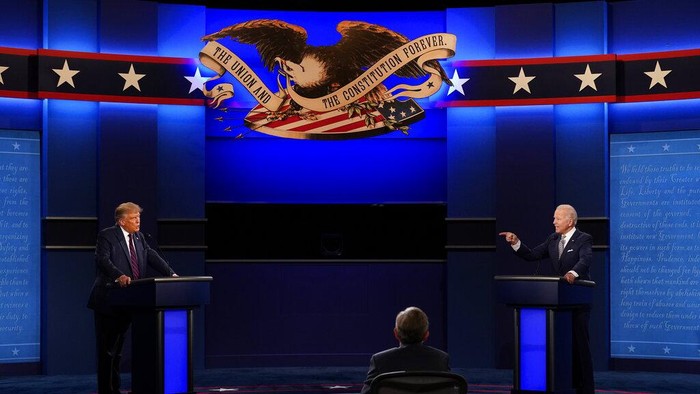 Moderator Chris Wallace of Fox News as well as President Donald Trump and Democratic candidate former Vice President Joe Biden during the first presidential debate Tuesday, Sept. 29, 2020, at Case Western University and Cleveland Clinic, in Cleveland, Ohio. (AP Photo/Patrick Semansky)