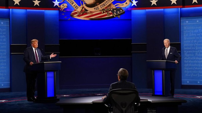 Moderator Chris Wallace of Fox News listens as President Donald Trump and Democratic candidate former Vice President Joe Biden participate in the first presidential debate Tuesday, Sept. 29, 2020, at Case Western University and Cleveland Clinic, in Cleveland, Ohio. (AP Photo/Patrick Semansky)