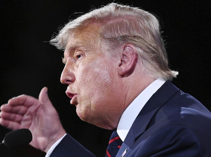 President Donald Trump and first lady Melania Trump walks off stage at the end of the first presidential debate Tuesday, Sept. 29, 2020, at Case Western University and Cleveland Clinic, in Cleveland, Ohio. (AP Photo/Julio Cortez)