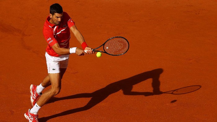 PARIS, FRANCE - OCTOBER 01: Novak Djokovic of Serbia plays a backhand during his Mens Singles second round match against Ricardas Berankis of Lithuania on day five of the 2020 French Open at Roland Garros on October 01, 2020 in Paris, France. (Photo by Julian Finney/Getty Images)