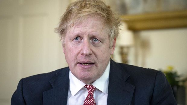 FILE - In this April 12, 2020, file photo issued by 10 Downing Street, Britain's Prime Minister Boris Johnson speaks from 10 Downing Street praising NHS staff in a video message after he was discharged from hospital a week after being admitted with persistent coronavirus symptoms, in London. Johnson was the first major world leader confirmed to have COVID-19. He was moved to intensive care in April after his virus symptoms dramatically worsened a day after he was hospitalized for what were called routine tests.  (Pippa Fowles/10 Downing Street via AP, File)