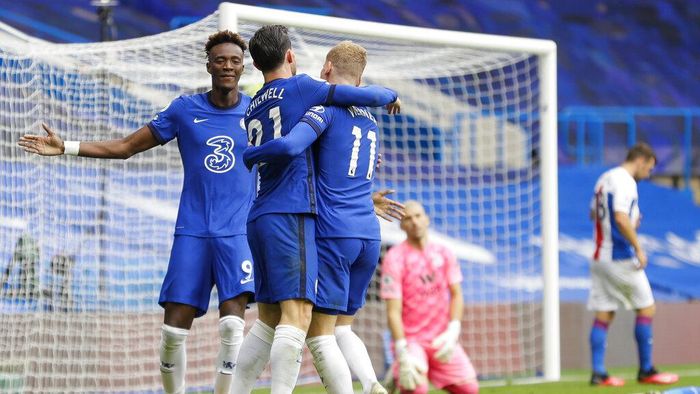 Chelsea vs Crystal Palace Chelseas Ben Chilwell, center, celebrates with his teammates Tammy Abraham, left, and Timo Werner after he scored his sides first goalduring the English Premier League soccer match between Chelsea and Crystal Palace at Stamford Bridge stadium in London, Saturday, Oct. 3, 2020. (AP Photo/Kirsty Wigglesworth, Pool)