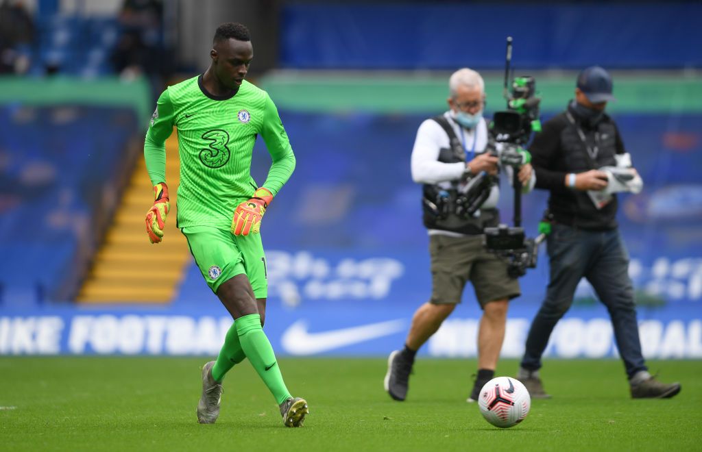 LONDON, ENGLAND - OCTOBER 03: Edouard Mendy of Chelsea warms up prior to the Premier League match between Chelsea and Crystal Palace at Stamford Bridge on October 03, 2020 in London, England. Sporting stadiums around the UK remain under strict restrictions due to the Coronavirus Pandemic as Government social distancing laws prohibit fans inside venues resulting in games being played behind closed doors. (Photo by Mike Hewitt/Getty Images)