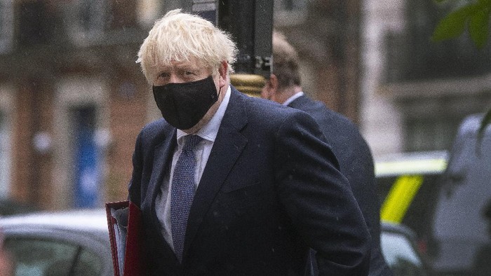 Britains Prime Minister Boris Johnson arrives at BBC Broadcasting House to appear on the Andrew Marr show, in London, Sunday, Oct. 4, 2020.  Johnson has defended his handling of the coronavirus pandemic, but warned that the country faces a “bumpy” winter ahead. Britain has Europe’s highest coronavirus death toll, at more than 42,000, and Johnson’s Conservative government is facing criticism from all sides. Opponents say tougher social restrictions are needed to suppress a second pandemic wave. (Victoria Jones/PA via AP)