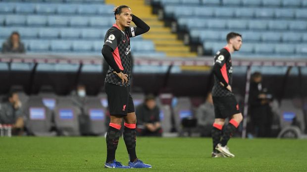 BIRMINGHAM, ENGLAND - OCTOBER 04: Virgil van Dijk of Liverpool reacts after Aston Villa score their 7th goal during the Premier League match between Aston Villa and Liverpool at Villa Park on October 04, 2020 in Birmingham, England. Sporting stadiums around the UK remain under strict restrictions due to the Coronavirus Pandemic as Government social distancing laws prohibit fans inside venues resulting in games being played behind closed doors. (Photo by Peter Powell - Pool/Getty Images)