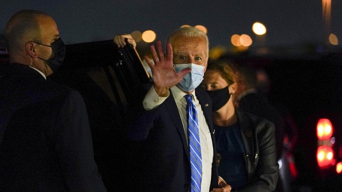 Democratic presidential candidate former Vice President Joe Biden boards his campaign plane at Miami International Airport in Miami, Monday, Oct. 5, 2020, to travel home to Wilmington, Del. (AP Photo/Andrew Harnik)