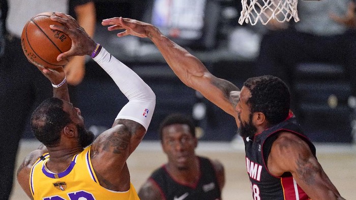 Los Angeles Lakers forward LeBron James shoots over Miami Heat guard Andre Iguodala during the first half in Game 4 of basketballs NBA Finals Tuesday, Oct. 6, 2020, in Lake Buena Vista, Fla. (AP Photo/Mark J. Terrill)