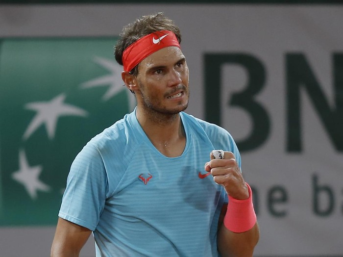 Spains Rafael Nadal clenches his fist after winning the first set against Italys Jannik Sinner in the quarterfinal match of the French Open tennis tournament at the Roland Garros stadium in Paris, France, Tuesday, Oct. 6, 2020. (AP Photo/Michel Euler)