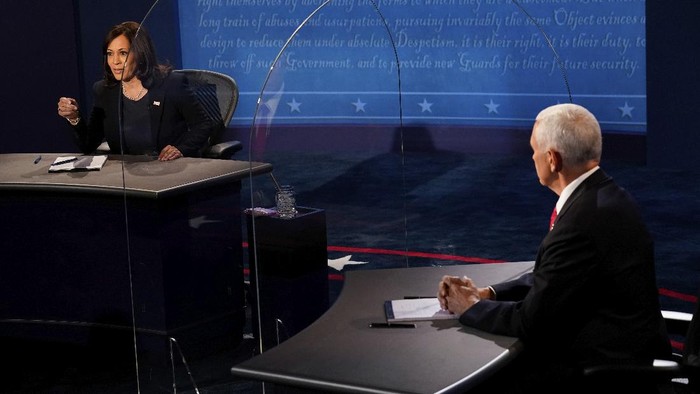 Democratic vice presidential candidate Sen. Kamala Harris, D-Calif., answers a question as Vice President Mike Pence listens during the vice presidential debate Wednesday, Oct. 7, 2020, at Kingsbury Hall on the campus of the University of Utah in Salt Lake City. (AP Photo/Morry Gash, Pool)