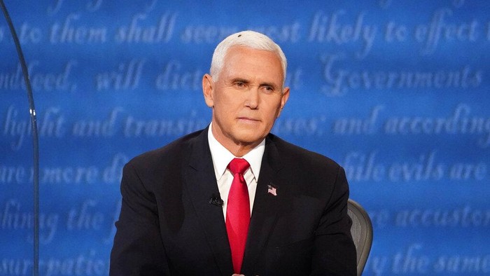 Vice President Mike Pence listens to Democratic vice presidential candidate Sen. Kamala Harris, D-Calif., during the vice presidential debate Wednesday, Oct. 7, 2020, at Kingsbury Hall on the campus of the University of Utah in Salt Lake City. (AP Photo/Julio Cortez)