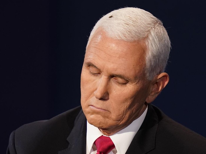 Vice President Mike Pence listens to Democratic vice presidential candidate Sen. Kamala Harris, D-Calif., during the vice presidential debate Wednesday, Oct. 7, 2020, at Kingsbury Hall on the campus of the University of Utah in Salt Lake City. (AP Photo/Patrick Semansky)